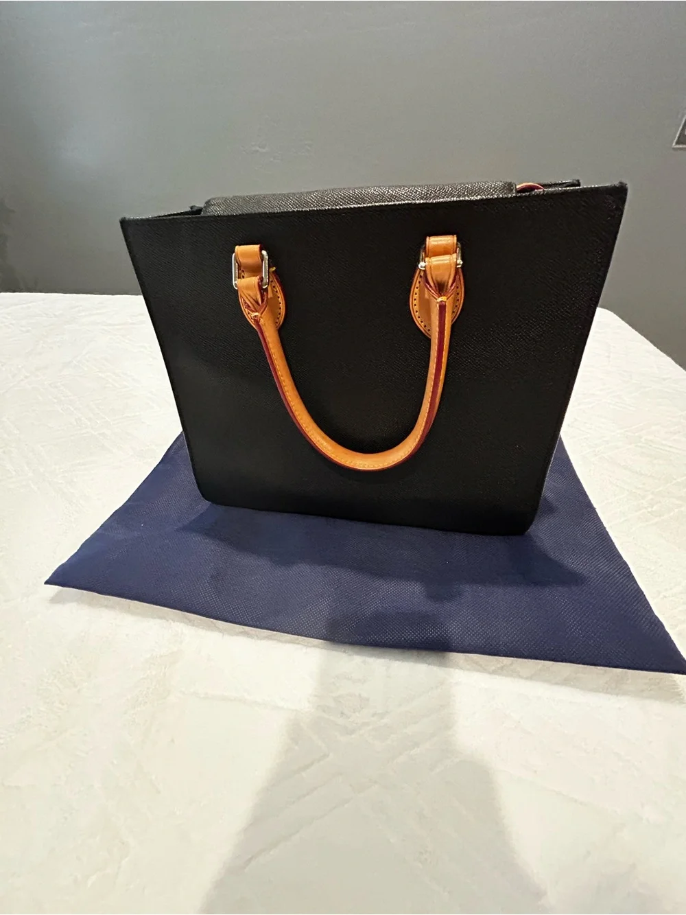 Dooney and Bourke Black Leather Satchel with Tan Leather Handles and Key Fob